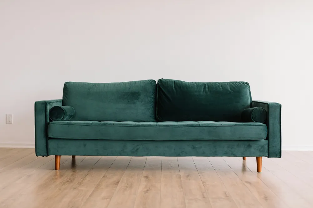 Green sofa ready for a furniture collection
